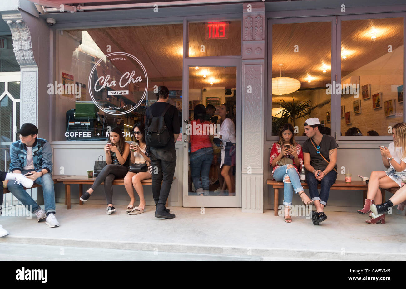 Young people waiting outside for a table at Cha Cha Matcha in Nolita in New York City Stock Photo