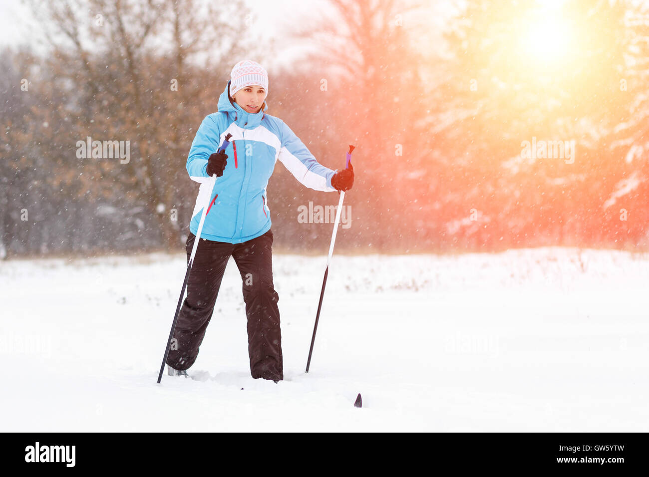 Young woman crosscountry skiing in winter park Stock Photo Alamy