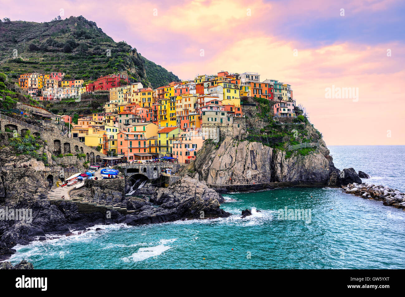 Colorful traditional houses on a rock over Mediterranean sea on