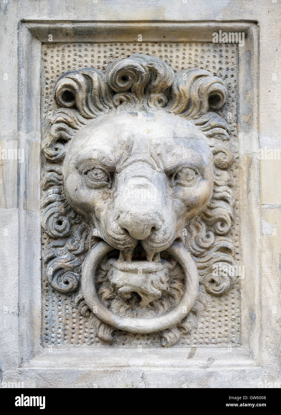 Stone lion head architectural decoration carved on a wall Stock Photo