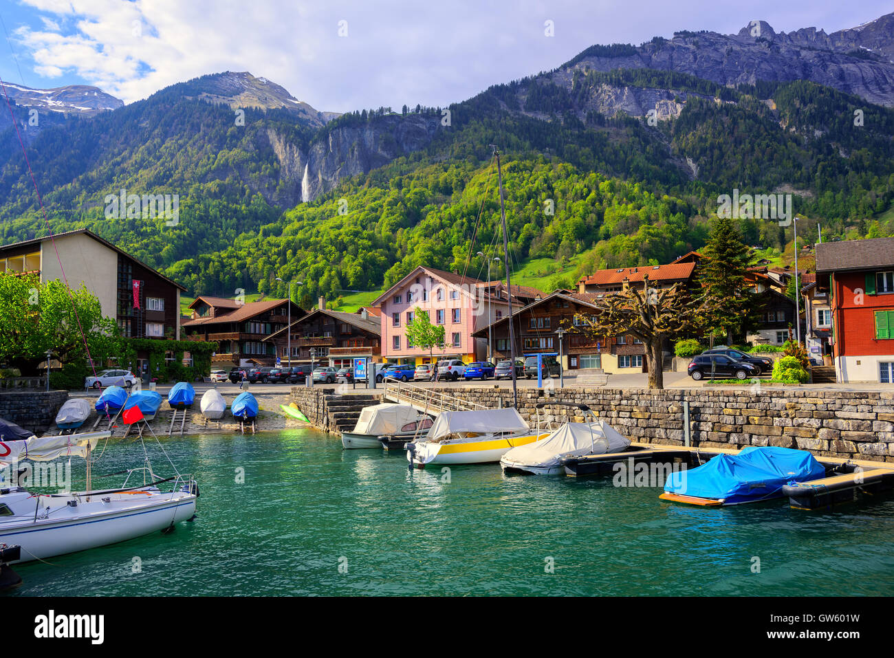 Small swiss town on Lake Brienz near Interlaken surrounded by Alps mountains, Switzerland Stock Photo