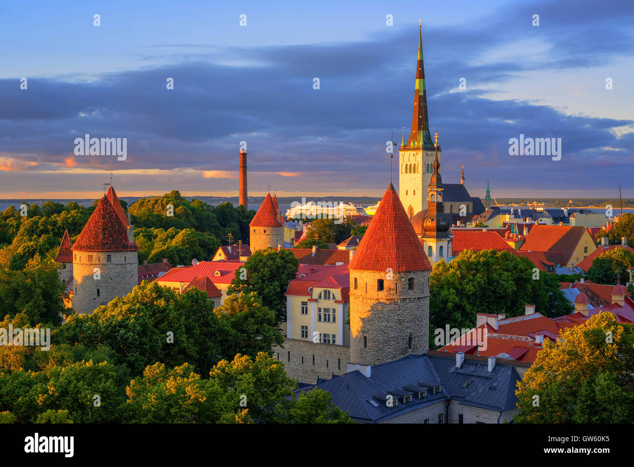St. Olaf's Church and medieval watch towers in the old town of Tallinn, Estonia, on sunset Stock Photo