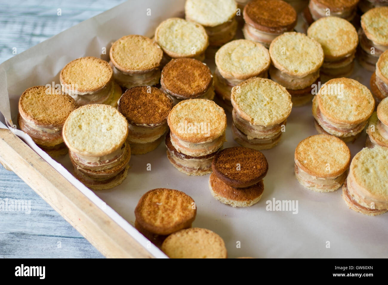 Yellow cookie sandwiches Stock Photo Alamy