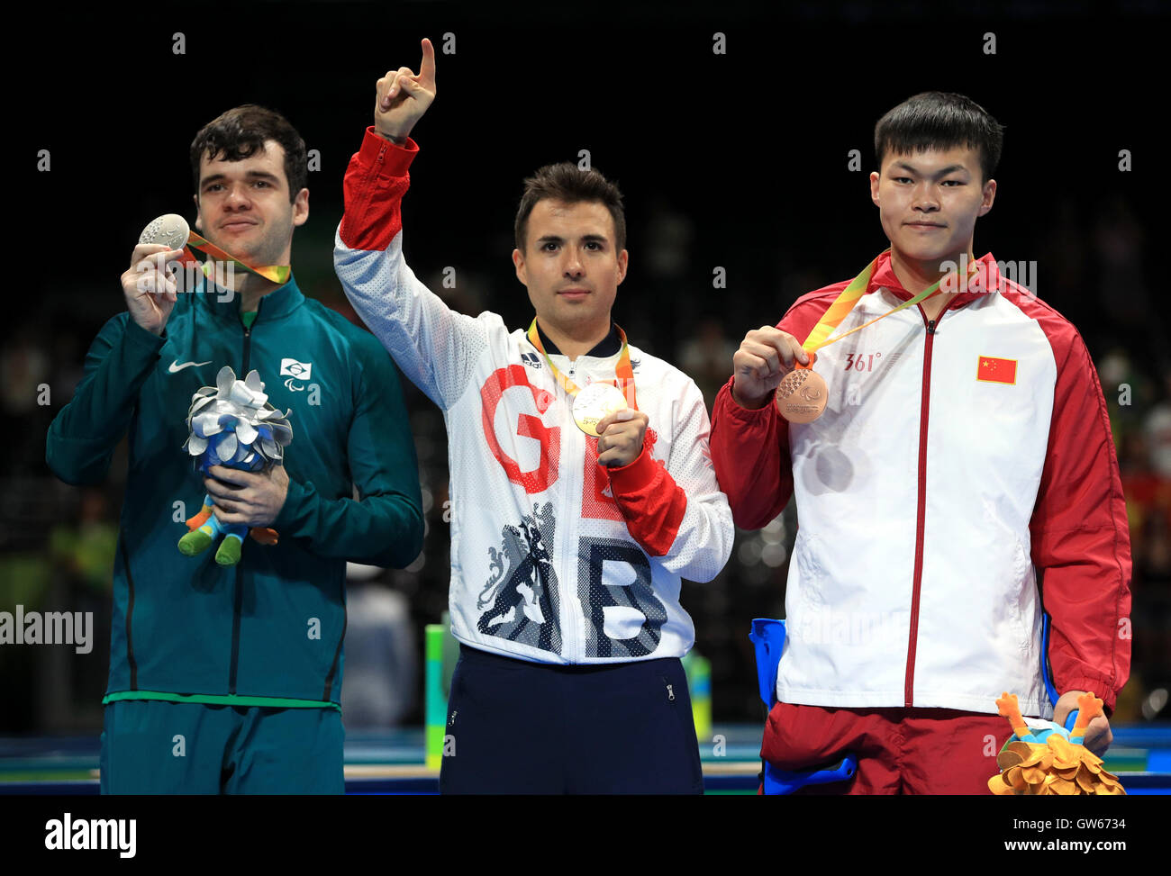 (left-right) Brazil's Israel Pereira Stroh, Great Britain's Will Bayley and China's Shuo Yan take to the podium after the Class 7 Mens Singles Table Tennis Gold Medal Match, during the fifth day of the 2016 Rio Paralympic Games in Rio de Janeiro, Brazil. Stock Photo