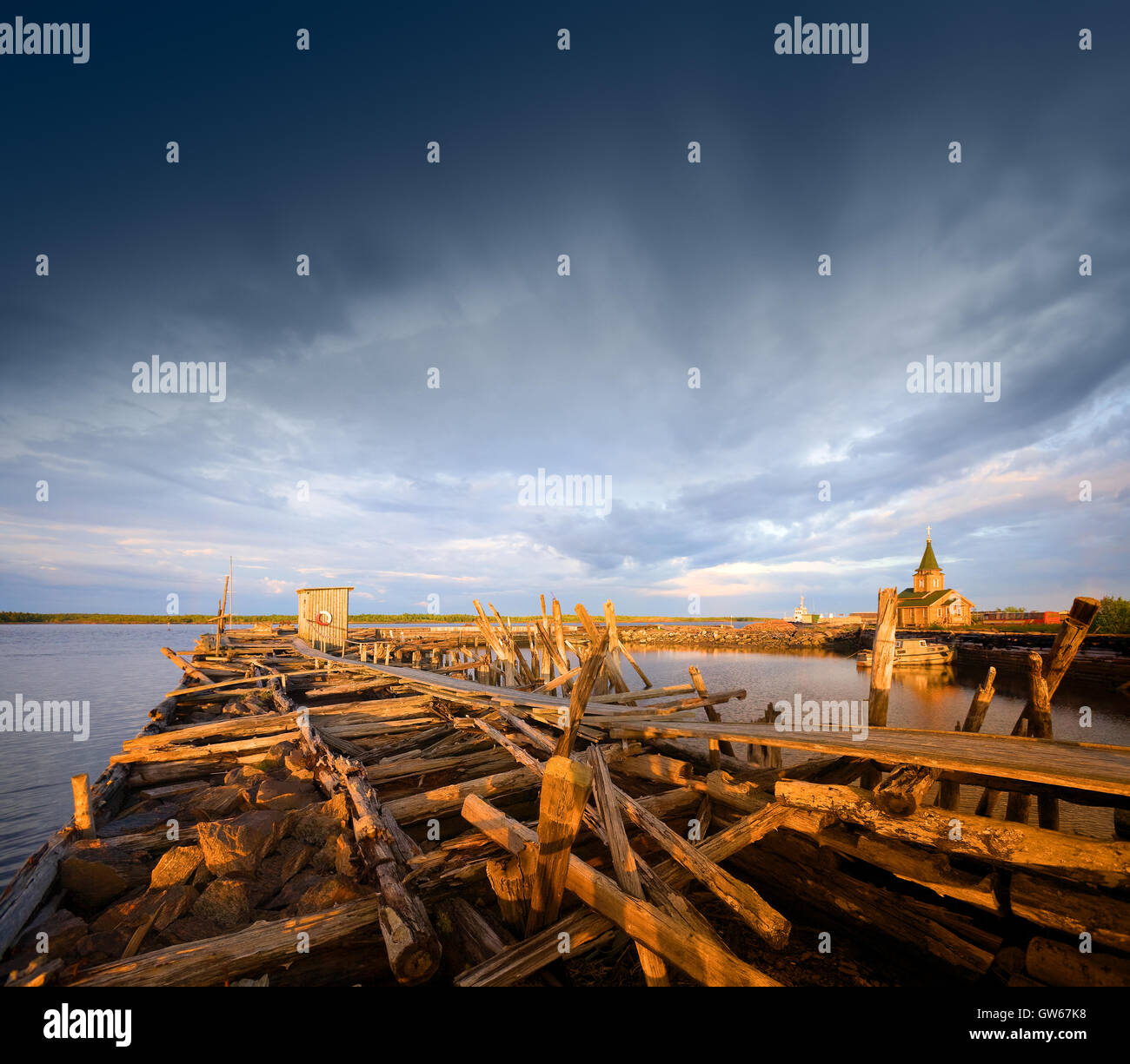 Old wooden pier at sunset. Stock Photo