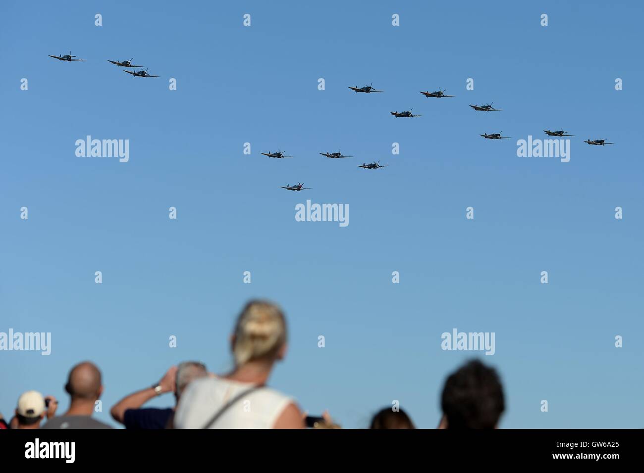 Fourteen Supermarine Spitfires take to the skies during The Duxford Air Show 2016 at The Imperial War Museum in Duxford, Cambridgeshire. Stock Photo