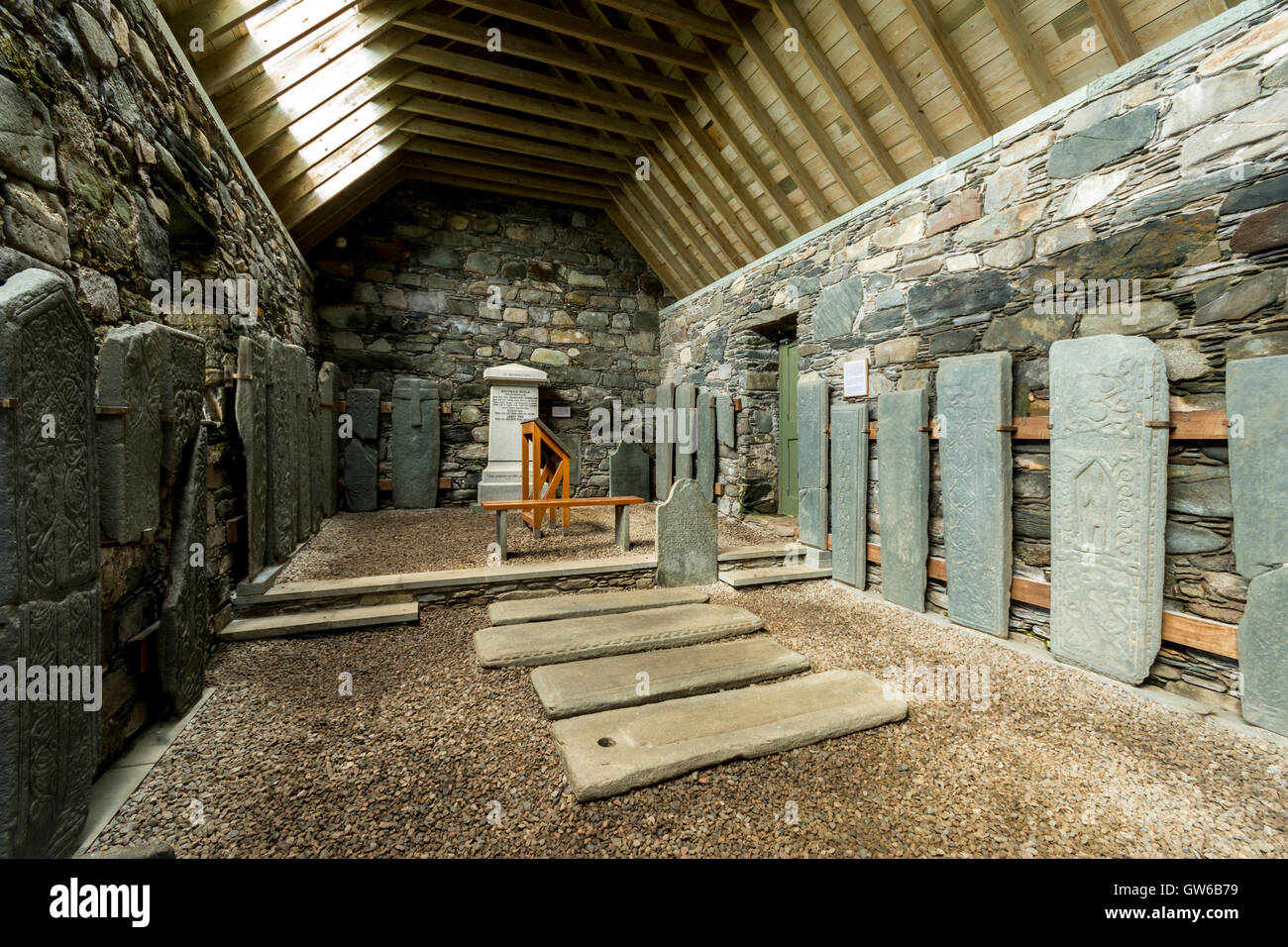 Ancient carved stones displayed inside Keills Chapel, Keillmore, Knapdale, Argyll and Bute, Scotland, UK Stock Photo