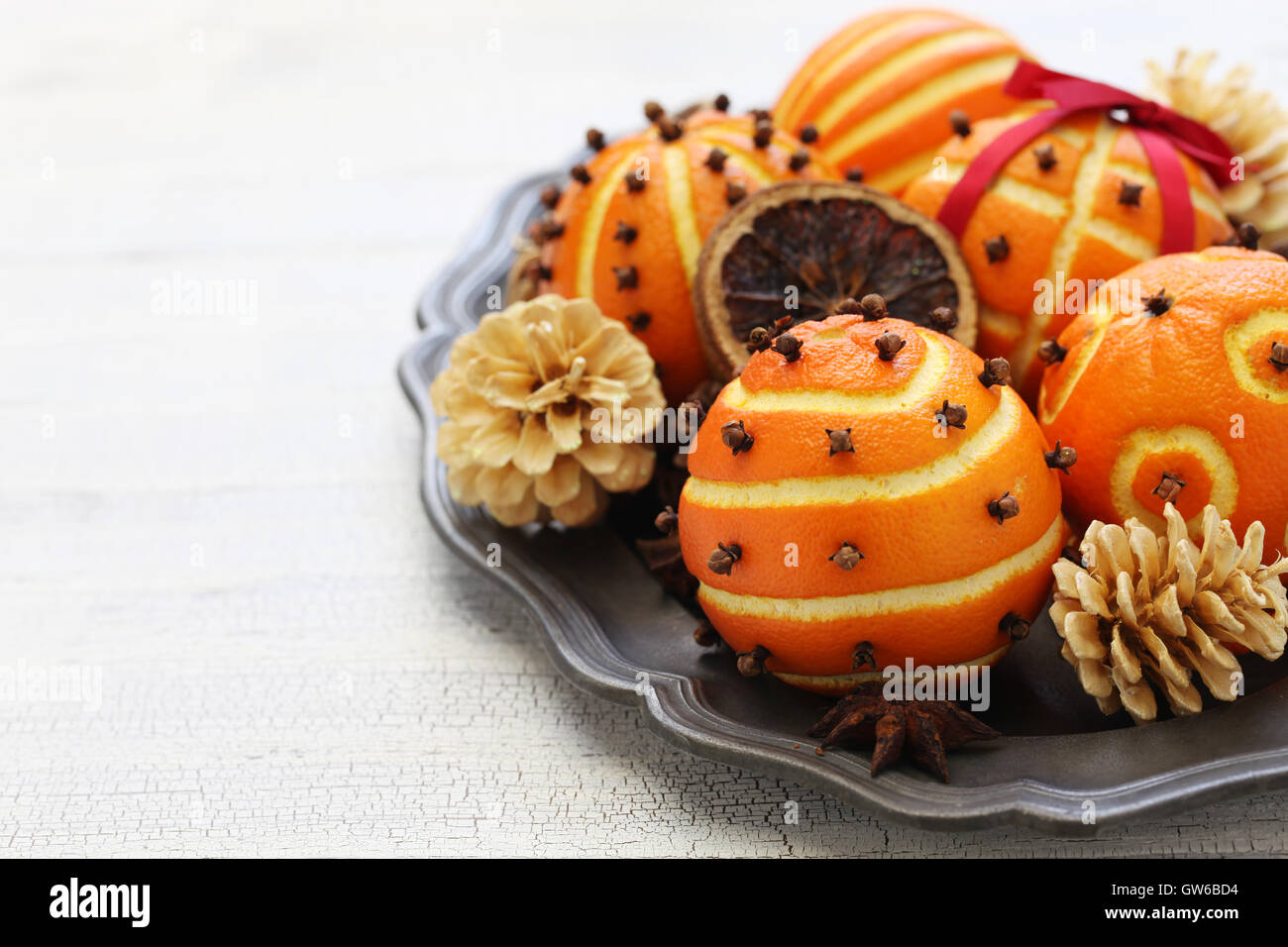 spiced orange pomander balls, scented christmas table decoration Stock Photo