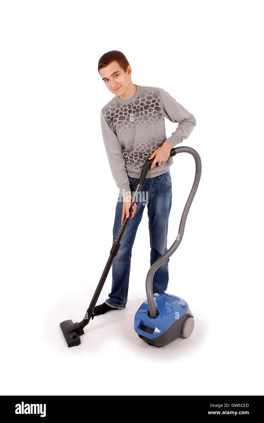 Boy with vacuum cleaner isolated on white background Stock Photo