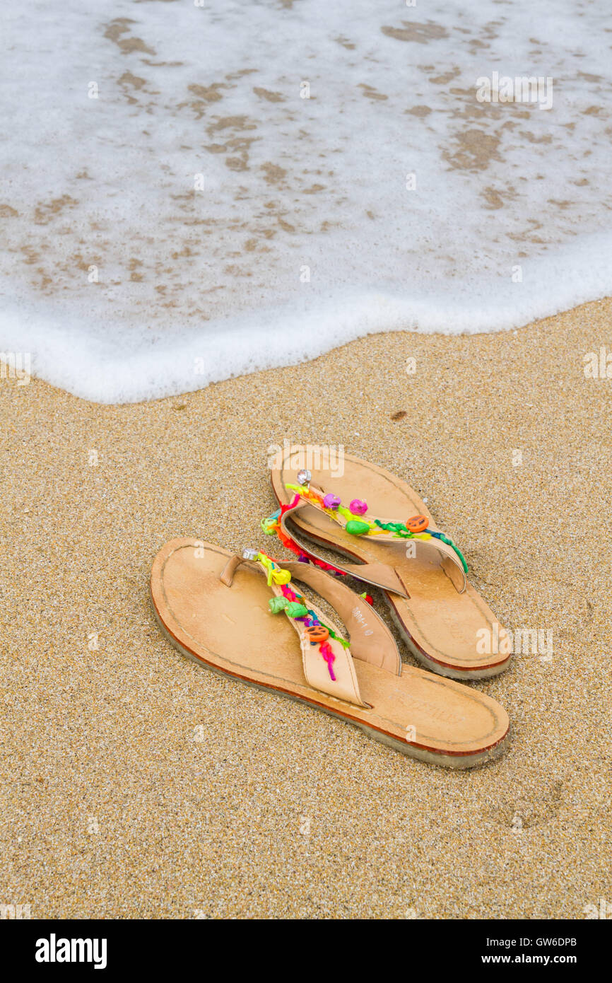 Summer flip flops on the beach Stock Photo - Alamy