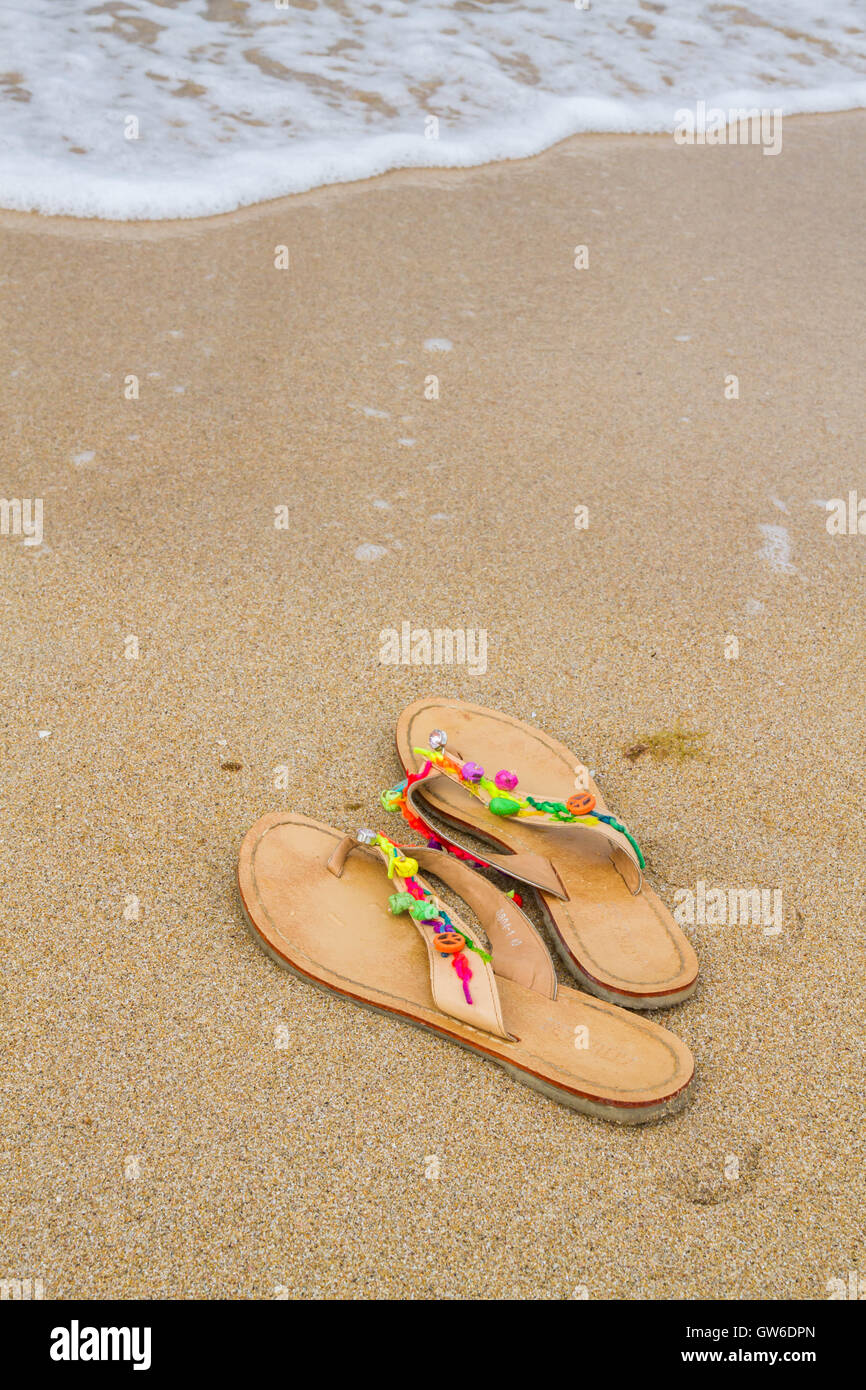 Summer flip flops on the beach Stock Photo - Alamy