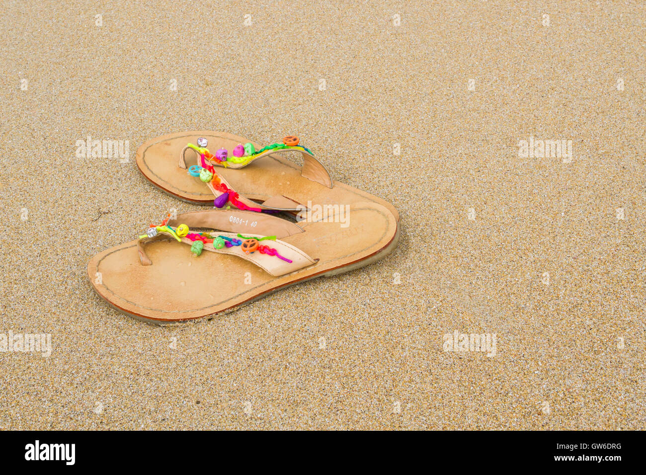 Summer flip flops on the beach Stock Photo - Alamy