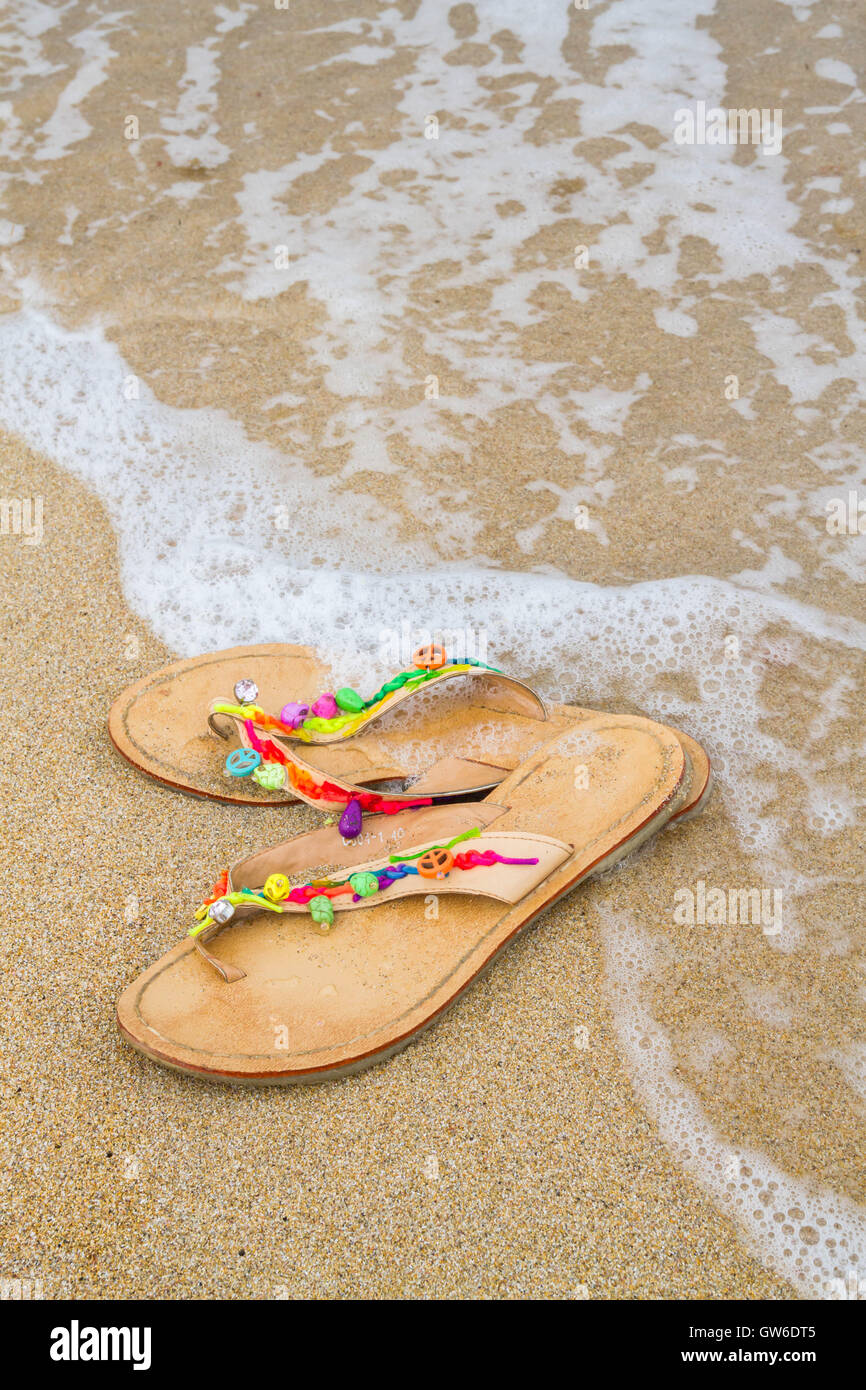 Summer flip flops on the beach Stock Photo - Alamy