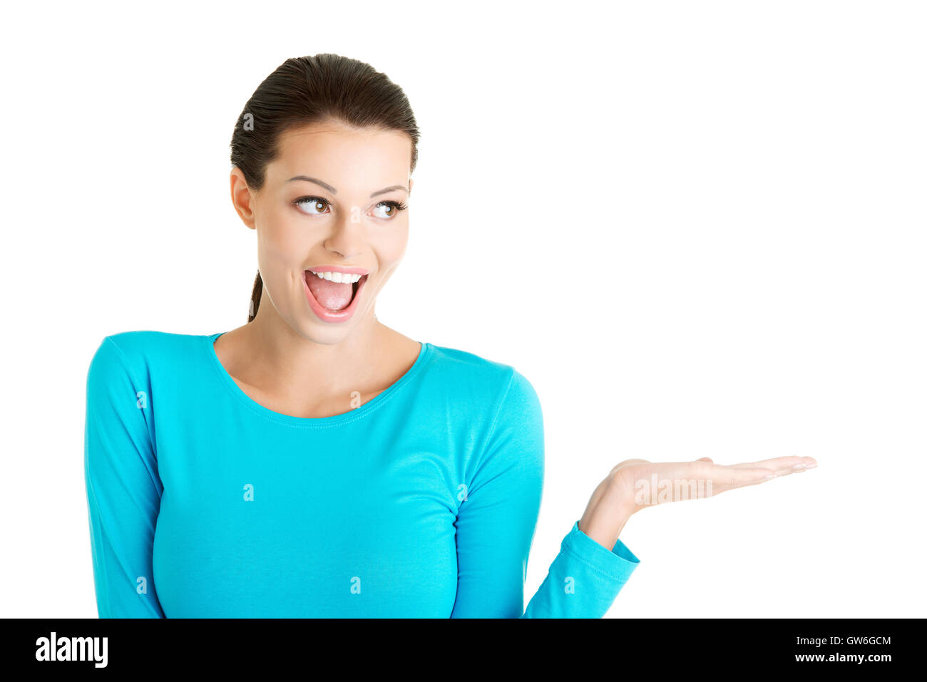 Young woman presenting copy space on her palm Stock Photo - Alamy