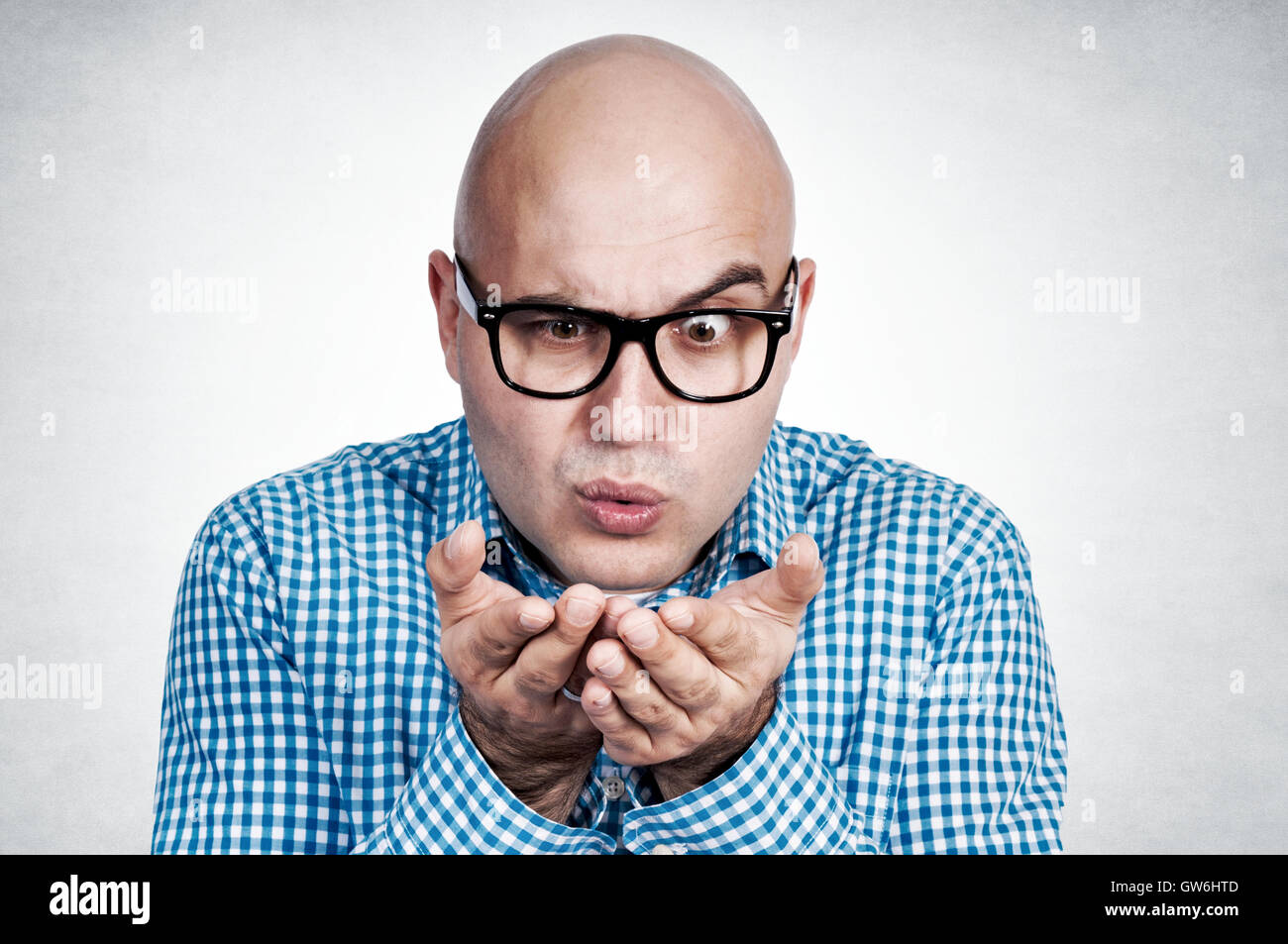 Man blowing hand Stock Photo Alamy