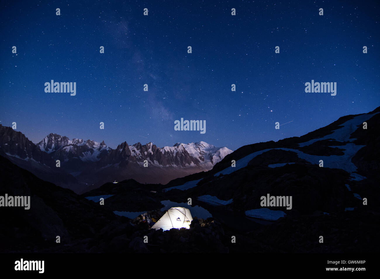 Tent under the stars, above lac blanc with mt blance and the milky way in the background Stock Photo