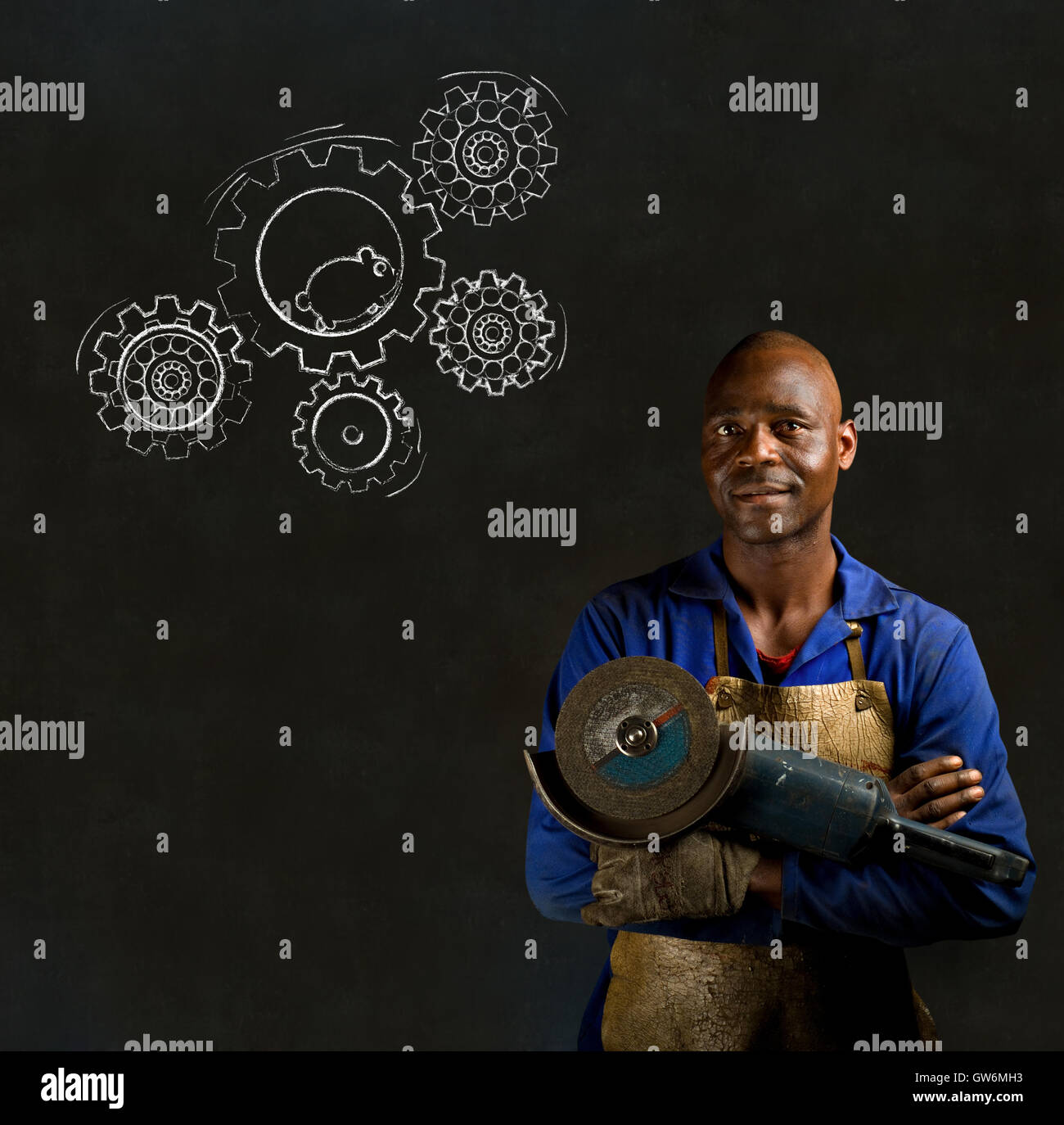 African black man industrial worker with chalk hamster gears blackboard Stock Photo