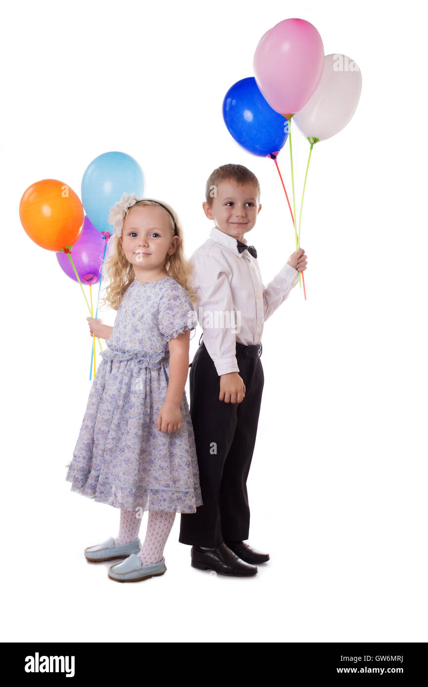 Sweet boy and girl with colorful balloons Stock Photo