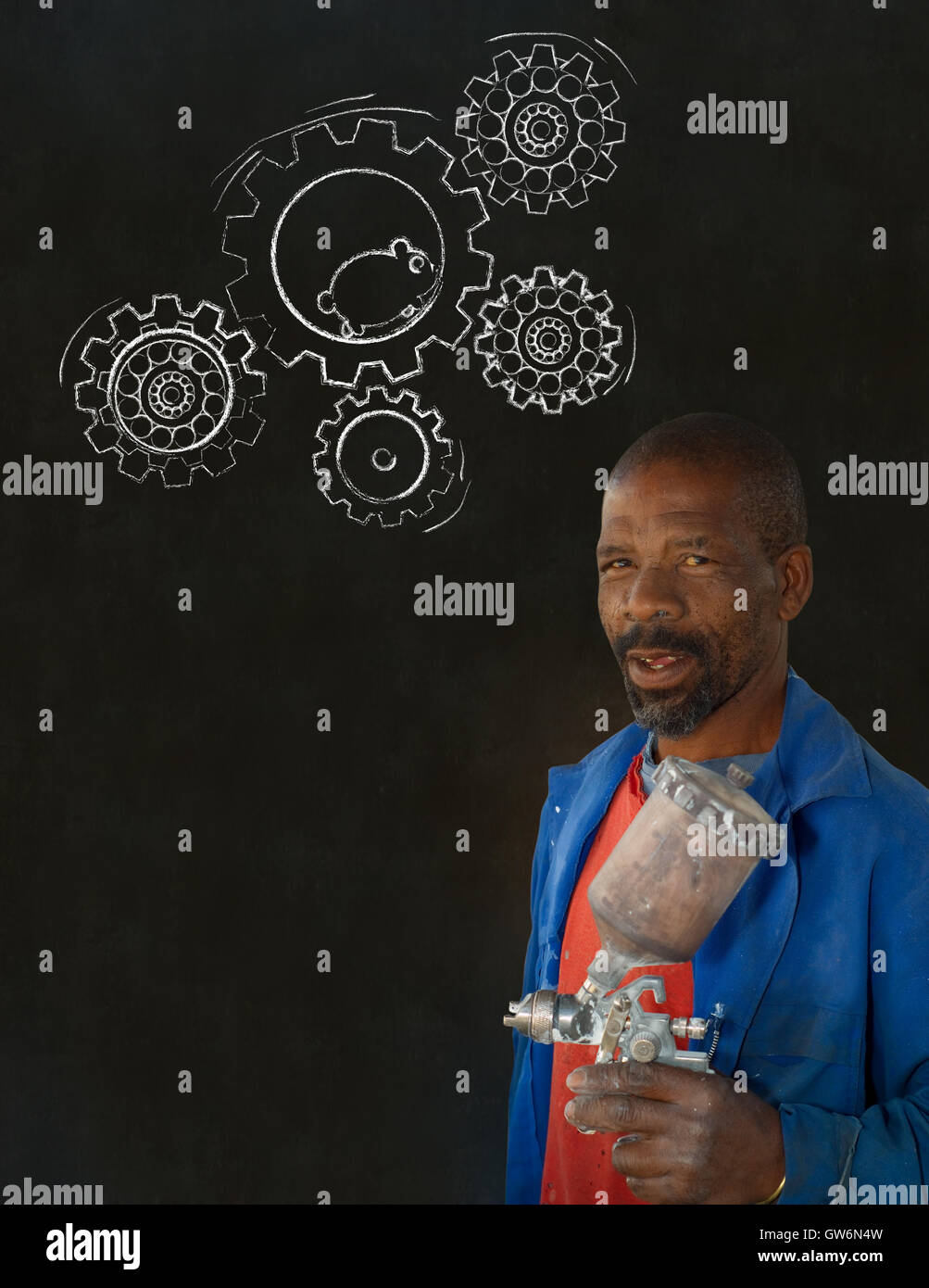 African black man industrial worker with chalk hamster gears blackboard Stock Photo