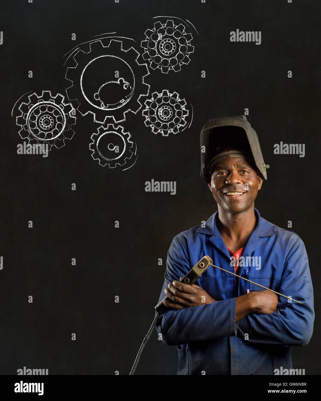 African black man industrial worker with chalk hamster gears blackboard Stock Photo