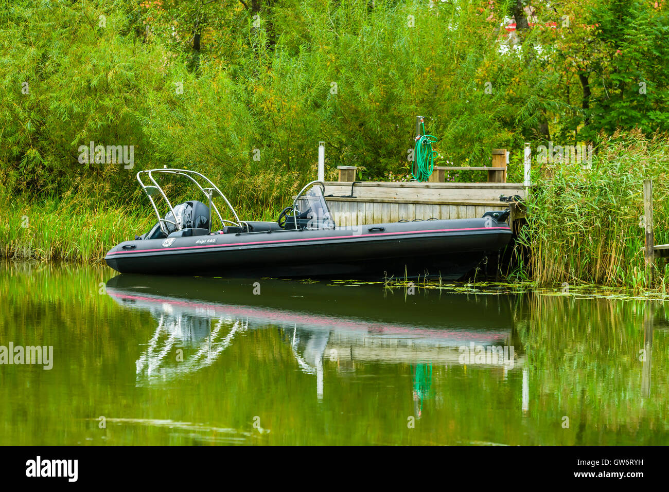 Kungalv, Sweden - September 8, 2016: The sales of new boats are rising. Here a Silver Marine expo 660 boat moored riverside at s Stock Photo