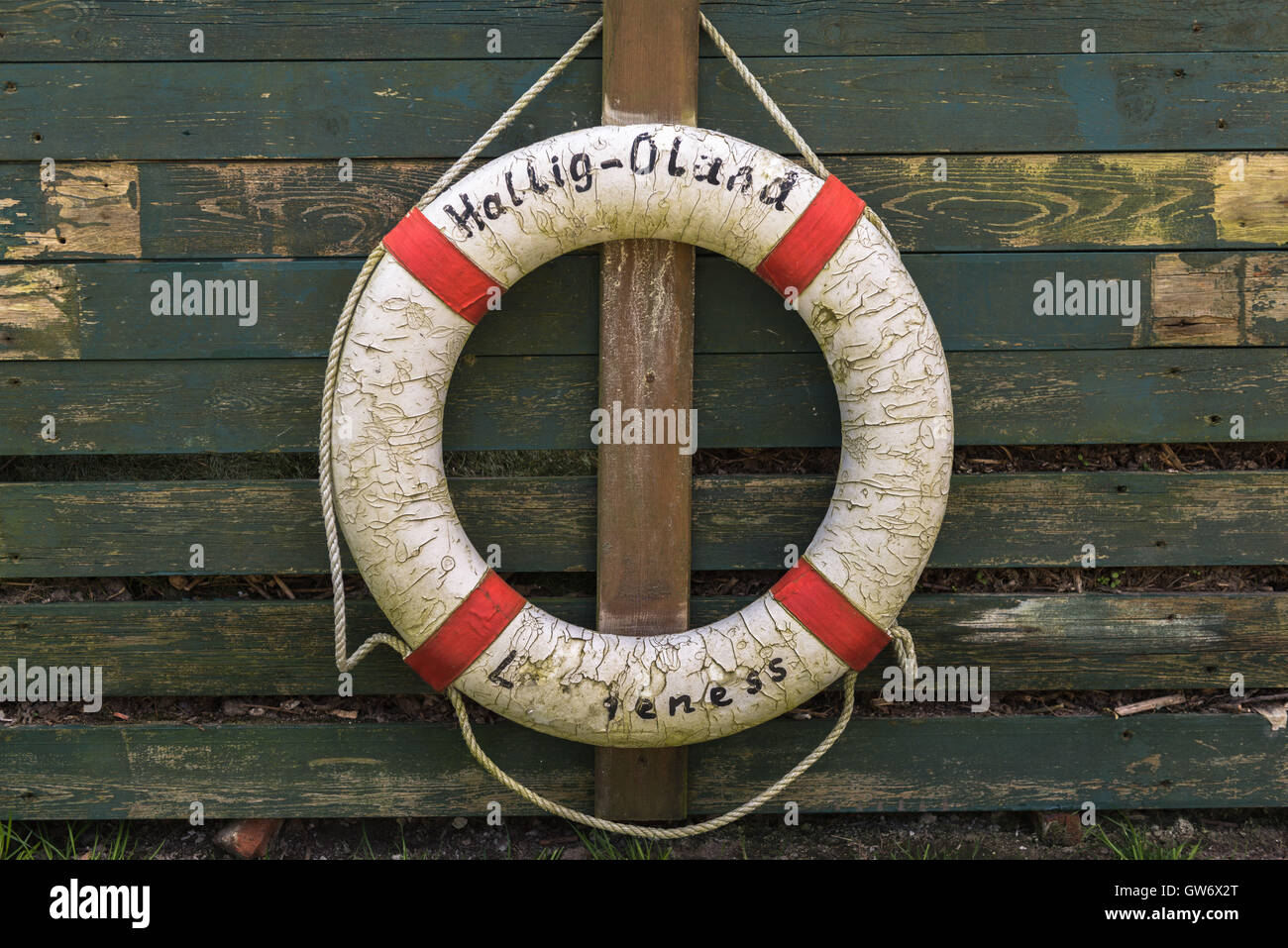 An old rescue belt hanging at a wooden hut, islet of Langeness in the mud flats, North Sea, Schleswig-Holstein, Germany Stock Photo