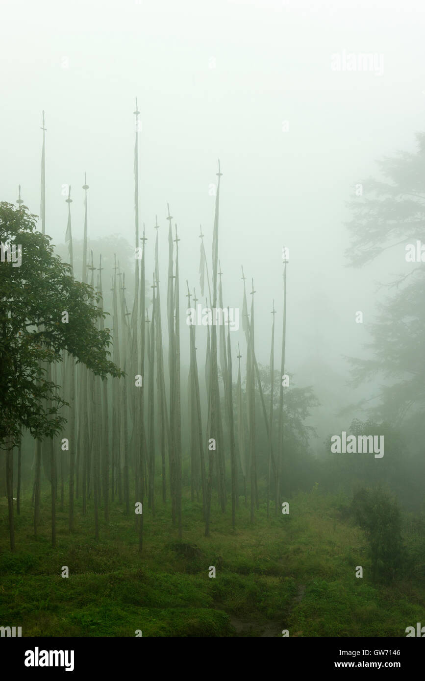 Mourning flags in the mist at Dochula Pass. Stock Photo