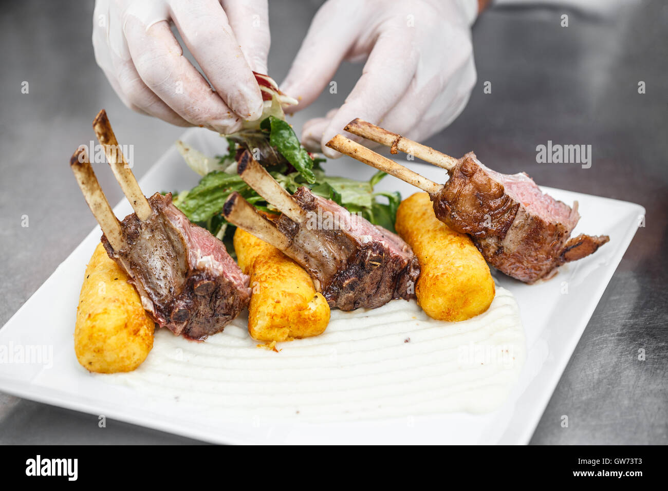 Rack of lamb with mashed potato-filled croquettes Stock Photo - Alamy