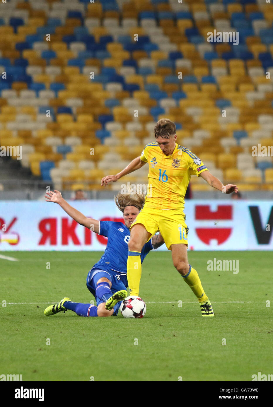 Serhiy Sydorchuk of Ukraine (in Yellow) fights for a ball with Birkir Bjarnason of Iceland during their FIFA World Cup 2018 game Stock Photo
