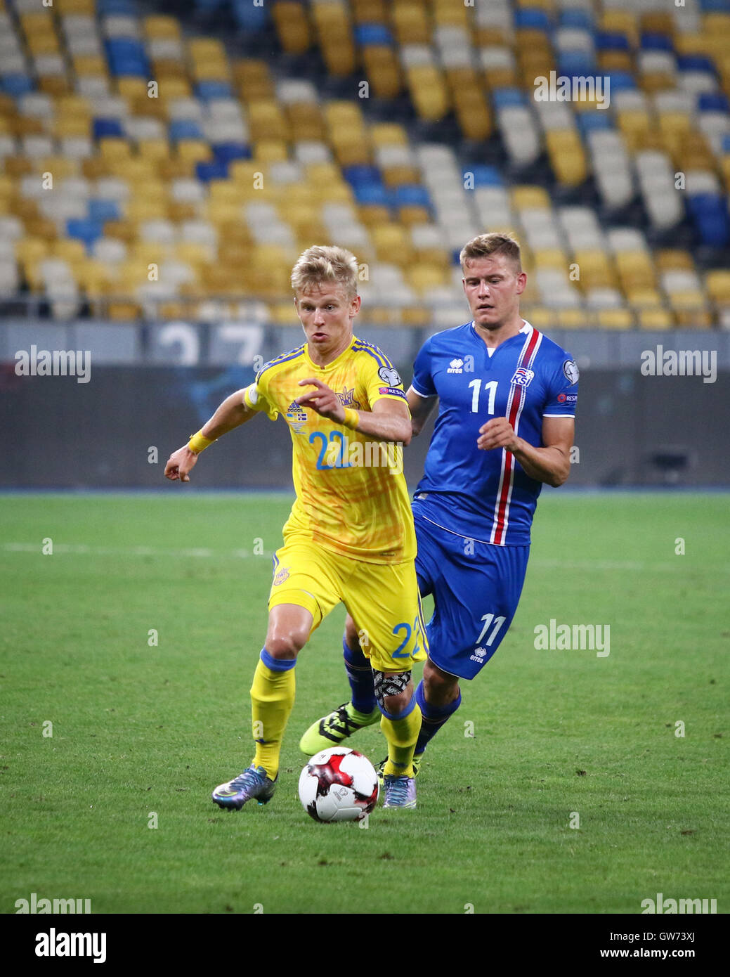 Olexandr Zinchenko of Ukraine (L) fights for a ball with Alfred Finnbogason of Iceland during their FIFA World Cup 2018 game Stock Photo
