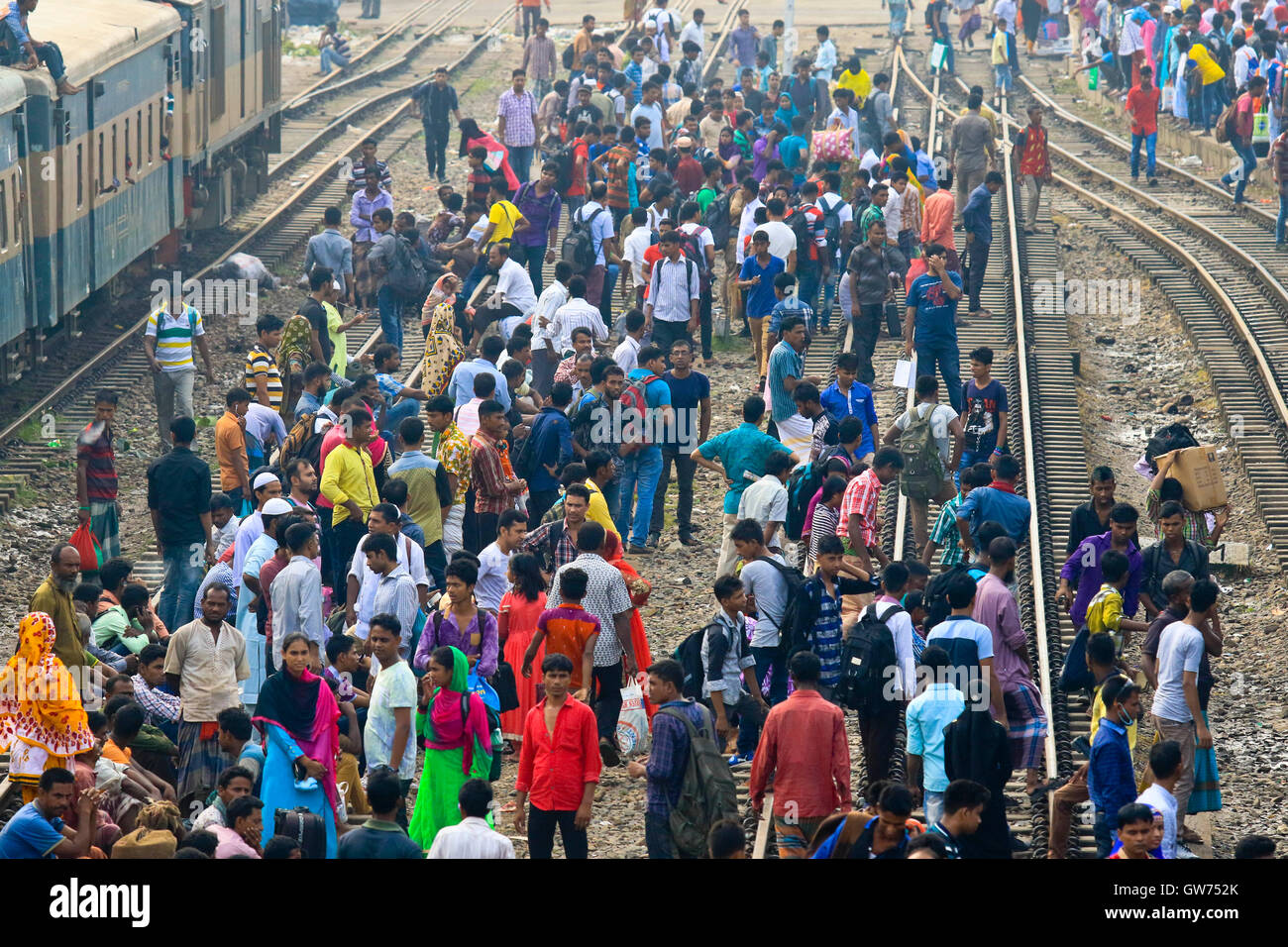 Dhaka, Bangladesh. 12 September, 2016: People wait at the Airport Railway station for a train to reach village home to spend Eid-ul-Azha holidays. Stock Photo