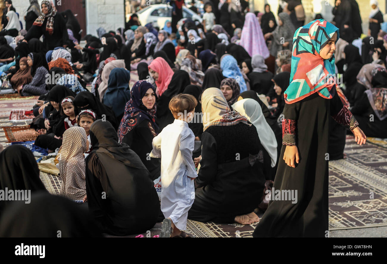 Khan Yunis, Gaza Strip, Occupied Palestinian Territory. 12th Sep, 2016. Palestinian women and children are involved in performing the Eid prayer on the first day of Eid al-Adha for Muslims. Credit:  Ahmad Salem/ZUMA Wire/Alamy Live News Stock Photo