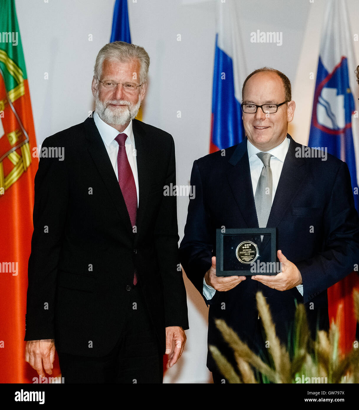Kiel, Germany. 12th Sep, 2016. Albert II, Prince of Monaco (R), poses with Peter Herzig, director of the GEOMAR ocean research center, after receiving the German Ocean Award 2016 in Kiel, Germany, 12 September 2016. Prince Albert was awarded for his engagement in protecting the oceans. Photo: MARKUS SCHOLZ/dpa/Alamy Live News Stock Photo