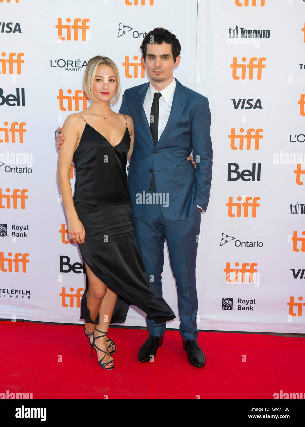 Toronto, Canada. 12th Sep, 2016. Director Damien Chazelle (R) and actress Olivia Hamilton pose for photos before the Canadian premiere of the film 'La La Land' at the Princess of Wales Theater during the 41st Toronto International Film Festival in Toronto, Canada, Sept. 12, 2016. Credit:  Zou Zheng/Xinhua/Alamy Live News Stock Photo