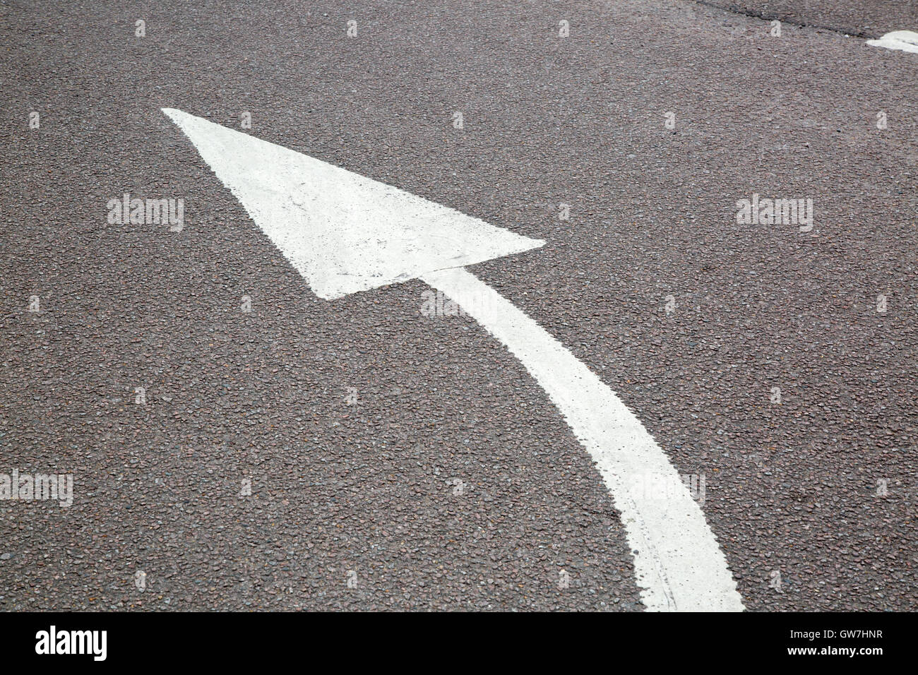 Curved Arrow Sign on Street Surface Stock Photo - Alamy