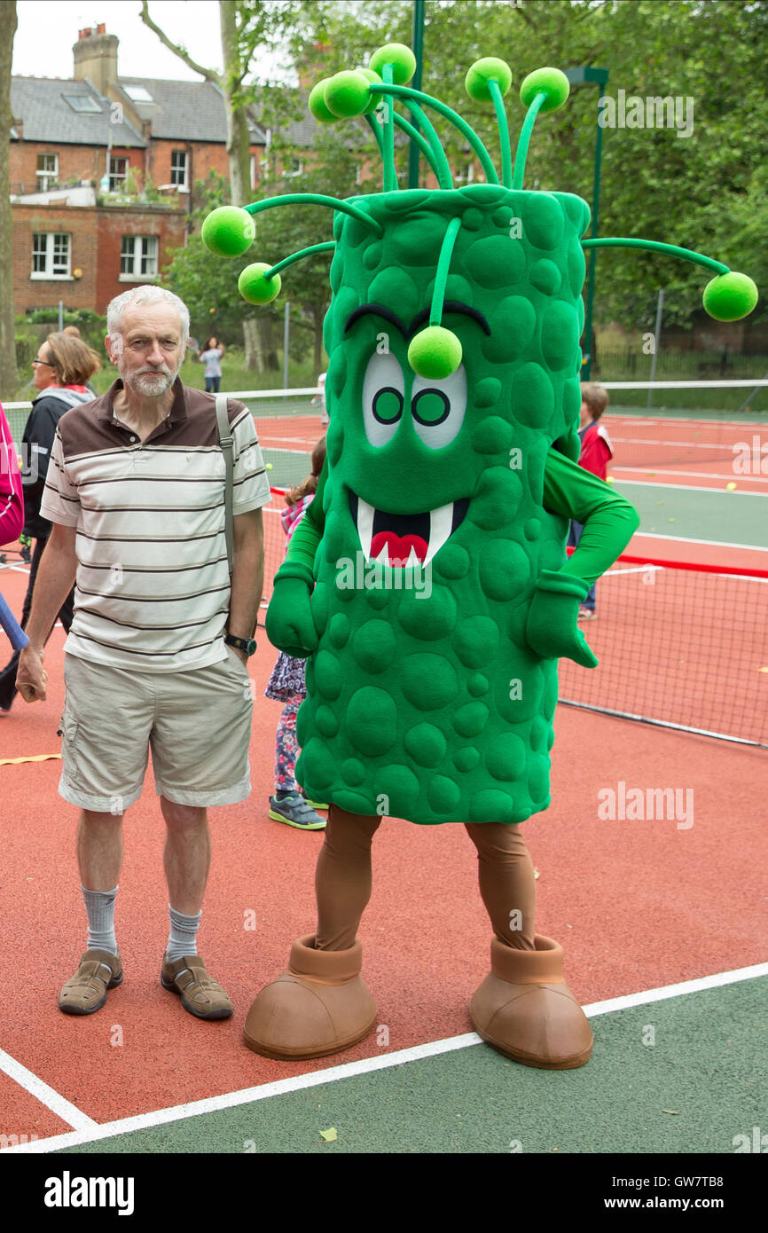 Jeremy Corbyn with a giant green monster at the Great British Tennis Weekend 2015 Stock Photo