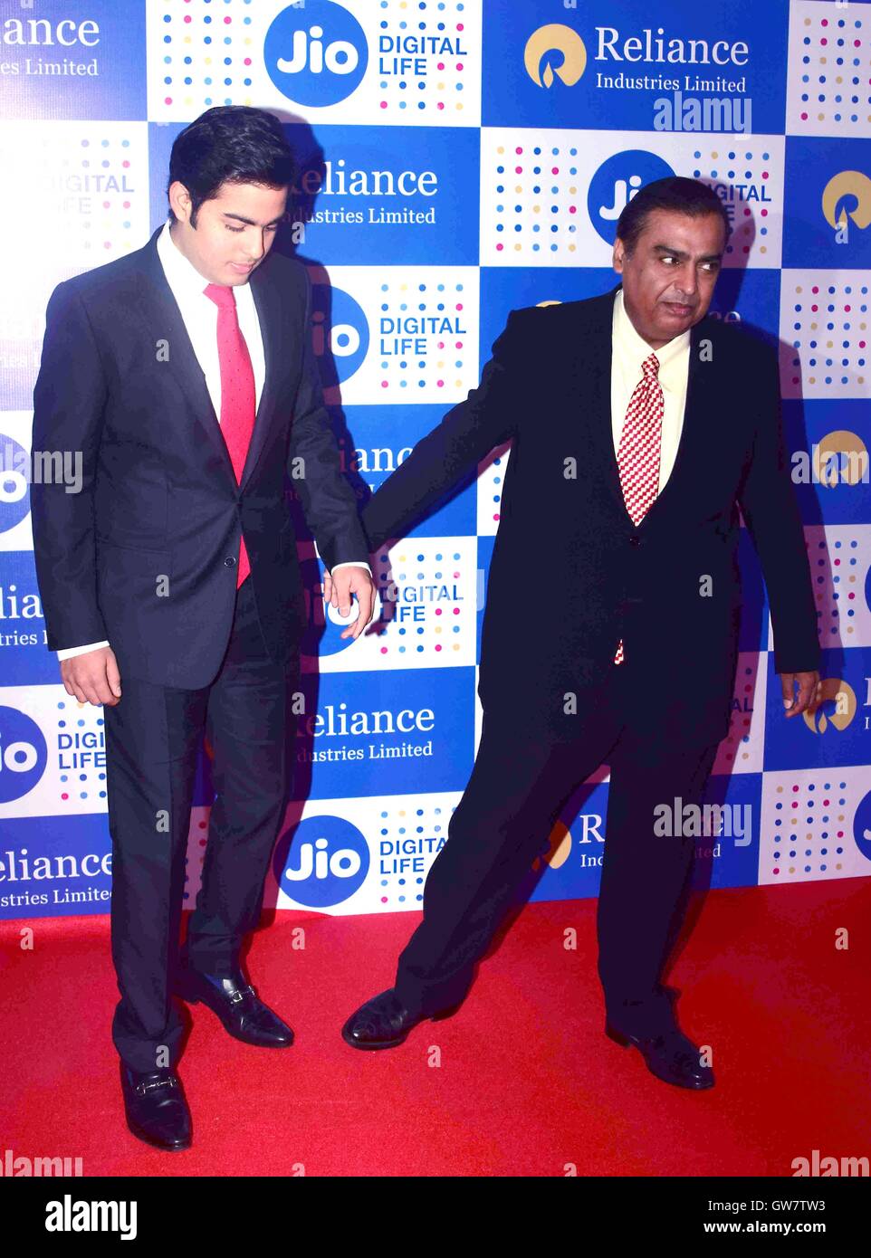 Reliance Industries Limited Chairman Mukesh Ambani with his son Akash Ambani Annual General Meeting Mumbai September 1, 2016 Stock Photo