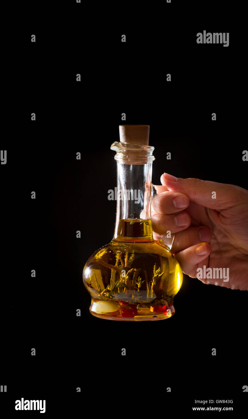 Bottle of olive oil with fresh herbs Stock Photo - Alamy