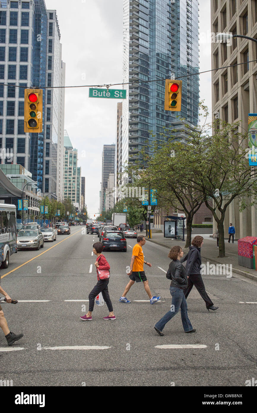 People crossing the street in  downtown Vancouver, Canada Stock Photo