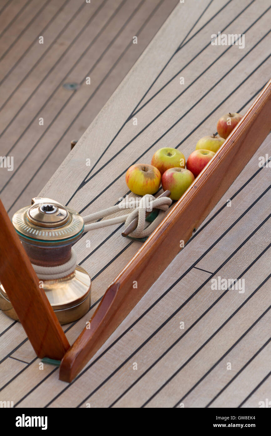 Apples on the deck of a classic sailing yacht Stock Photo