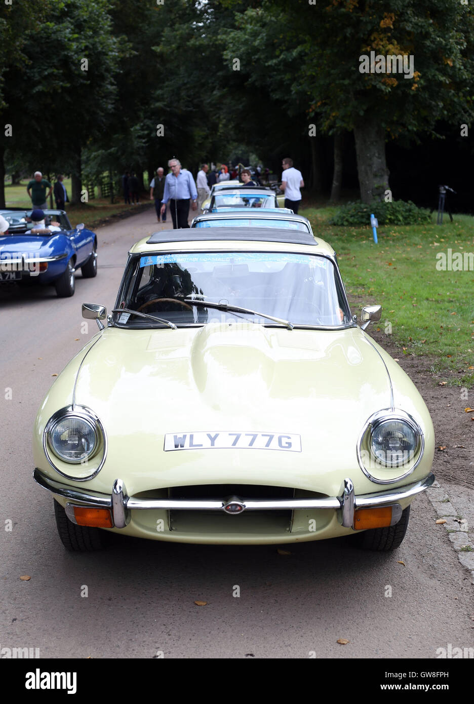 Jaguar E-type cars set off from Goodwood House in West Sussex on the E-type Round Britain Coastal Drive, a 3,600-mile coastal tour of Britain, in support of Prostate Cancer UK. Stock Photo