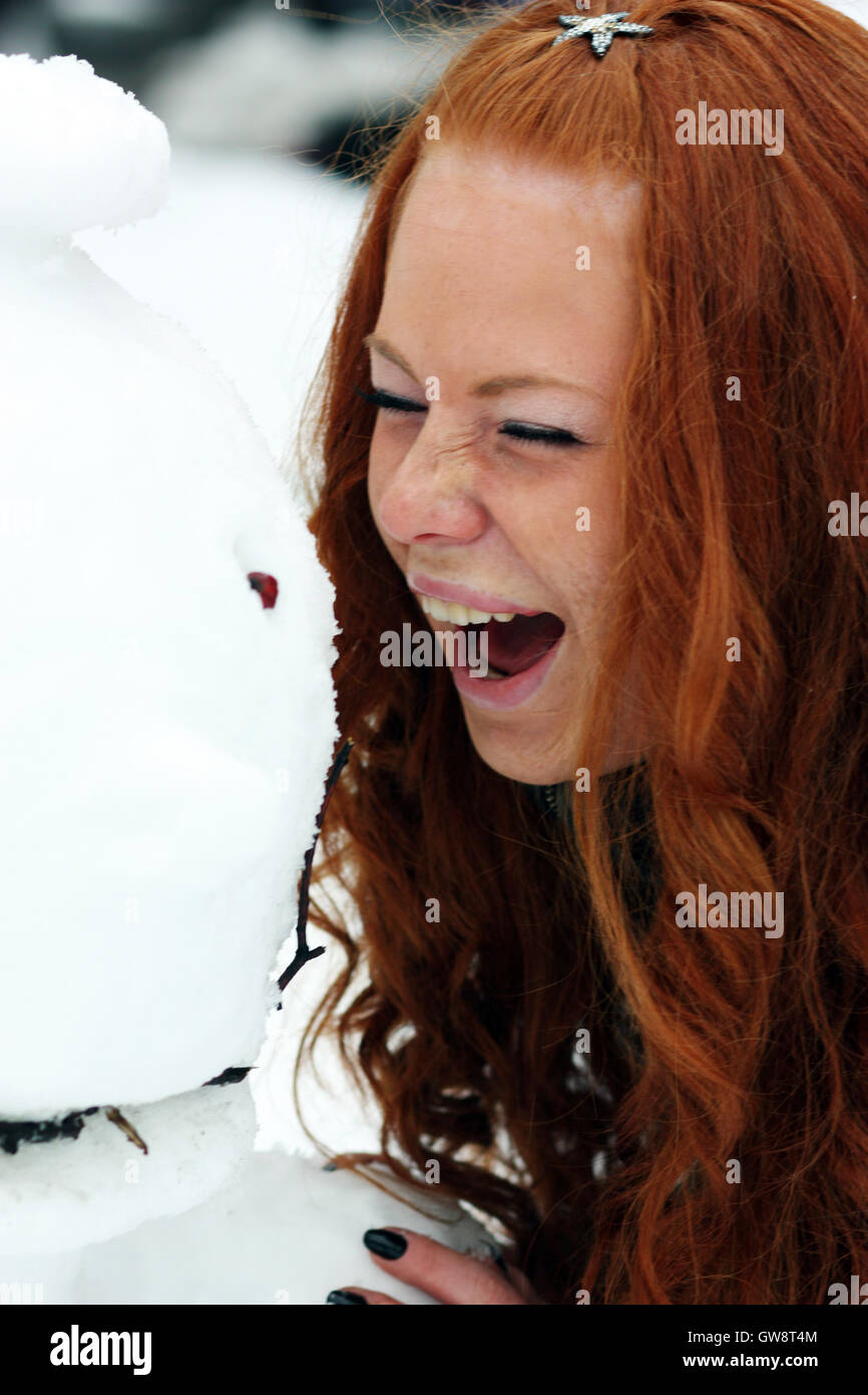 Winter woman in rest snow park Stock Photo