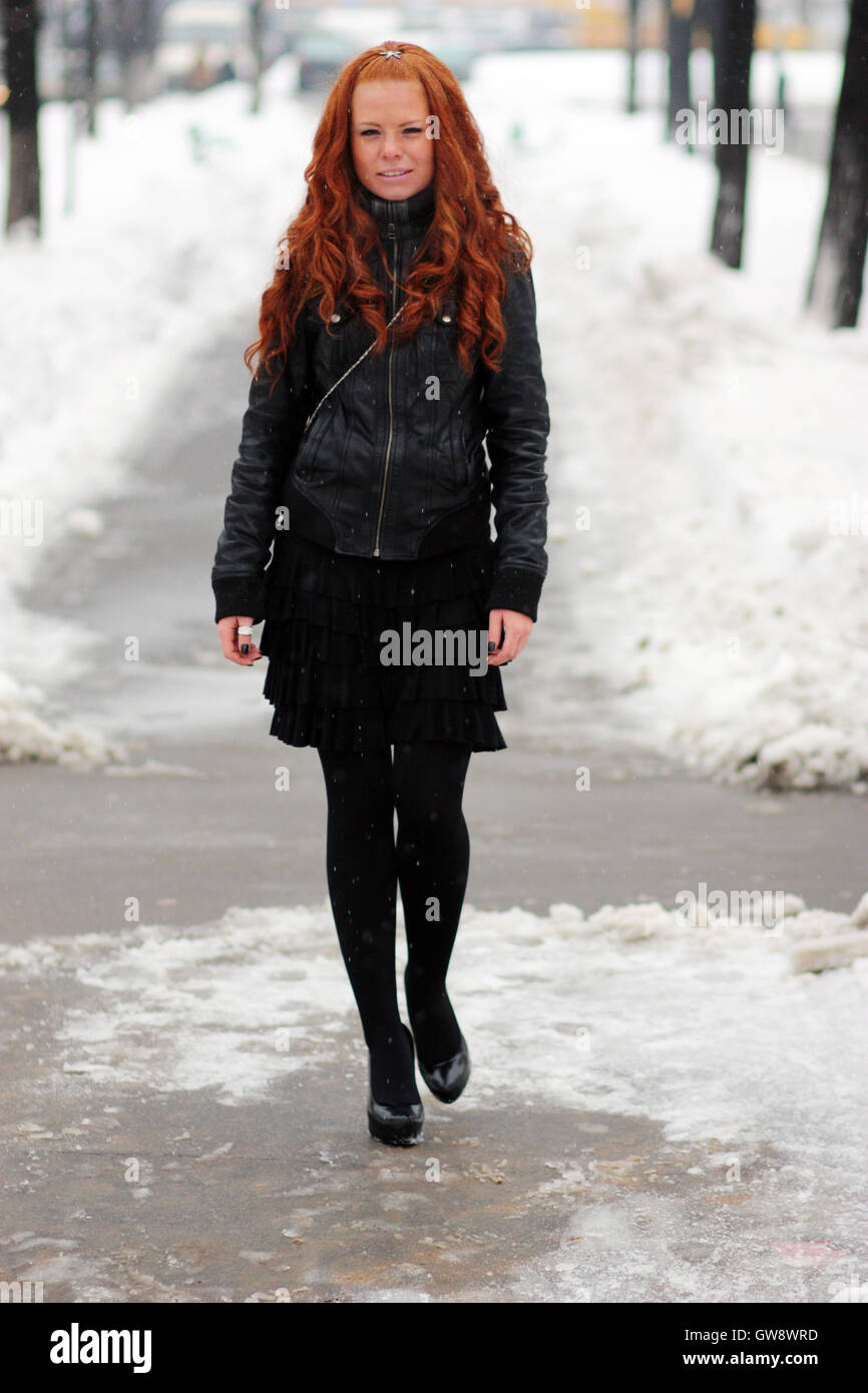 Winter woman in rest snow park Stock Photo