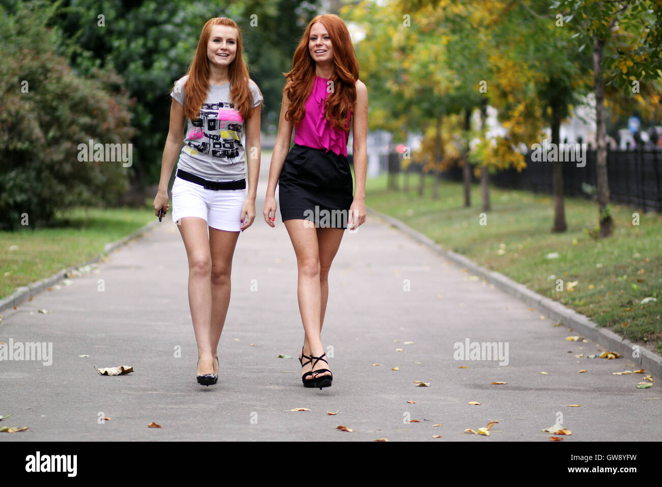 Two girls models walking hi-res stock photography and images - Alamy