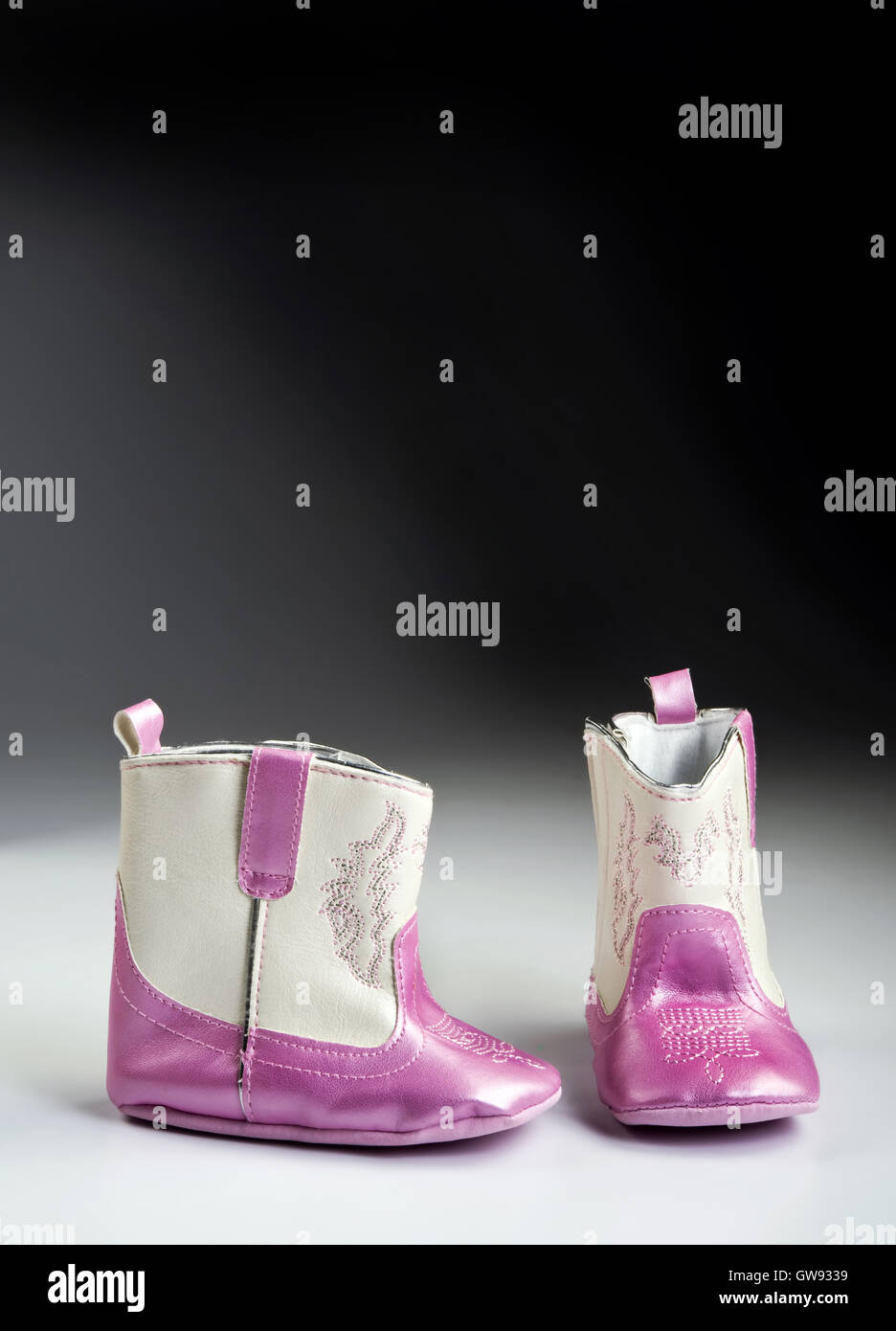Pink baby boots with room for your type Stock Photo Alamy