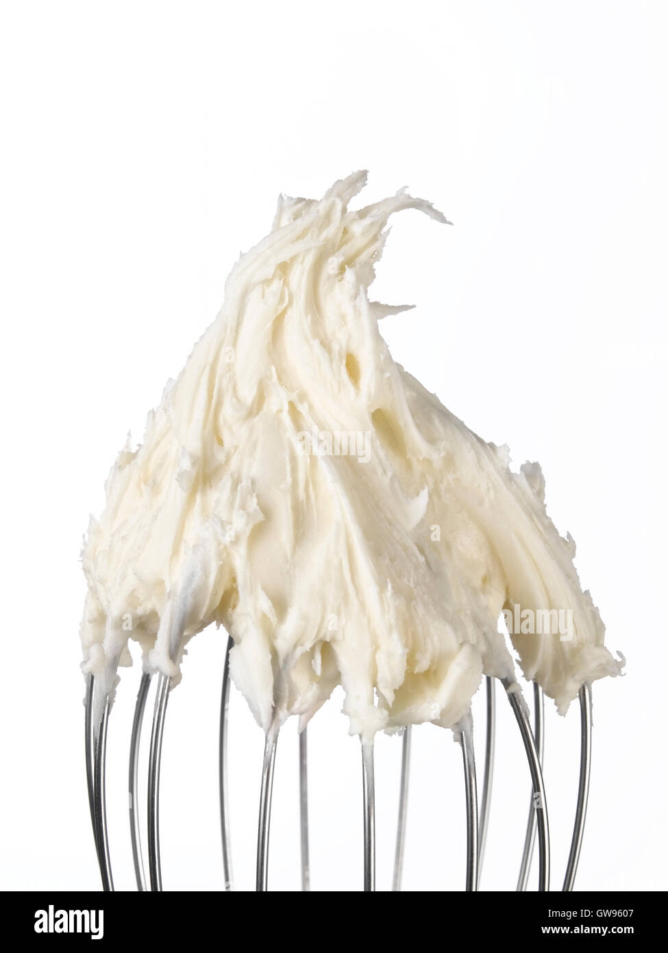 Kitchen whisk with cream Stock Photo