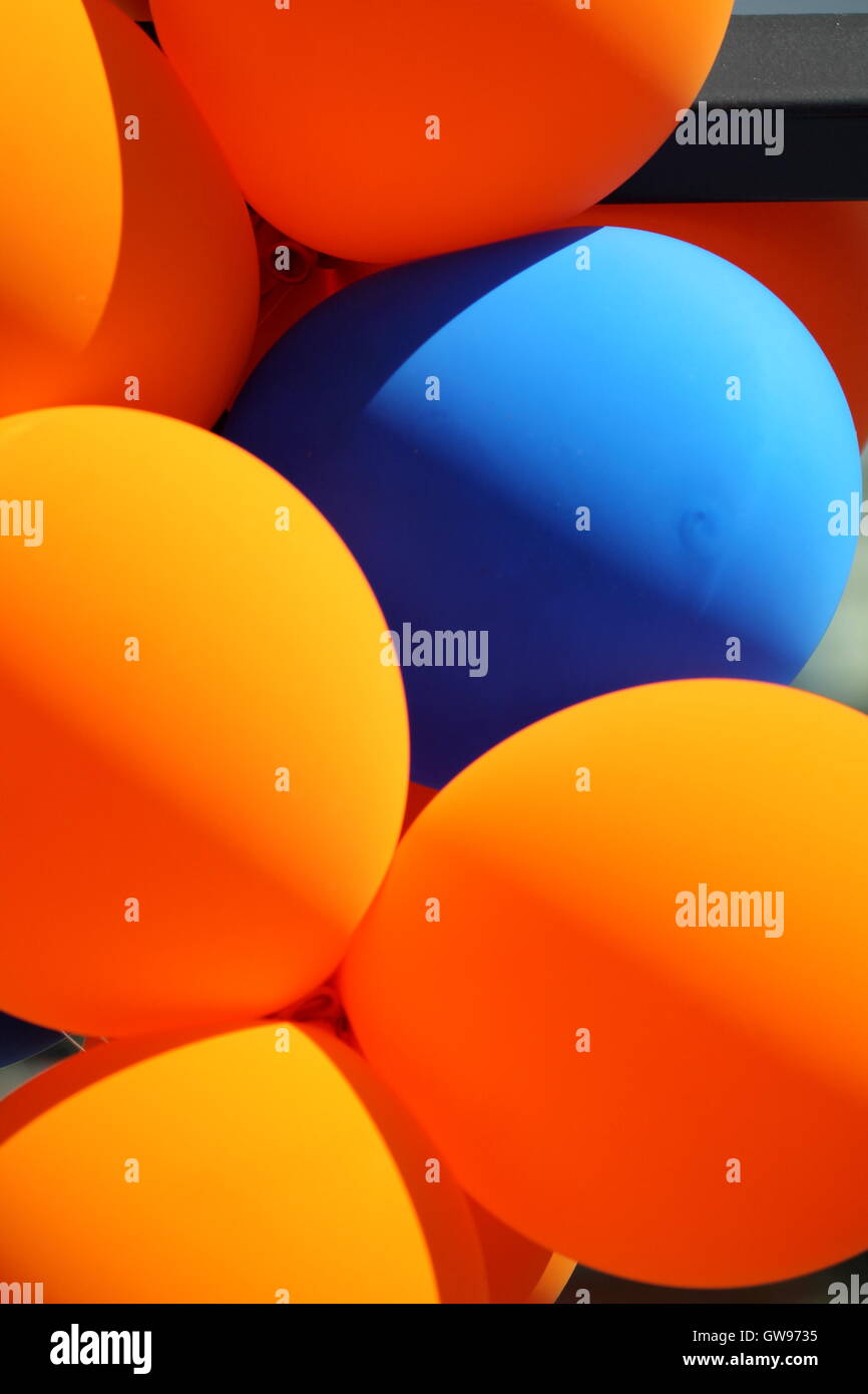 Orange and blue balloons Stock Photo - Alamy