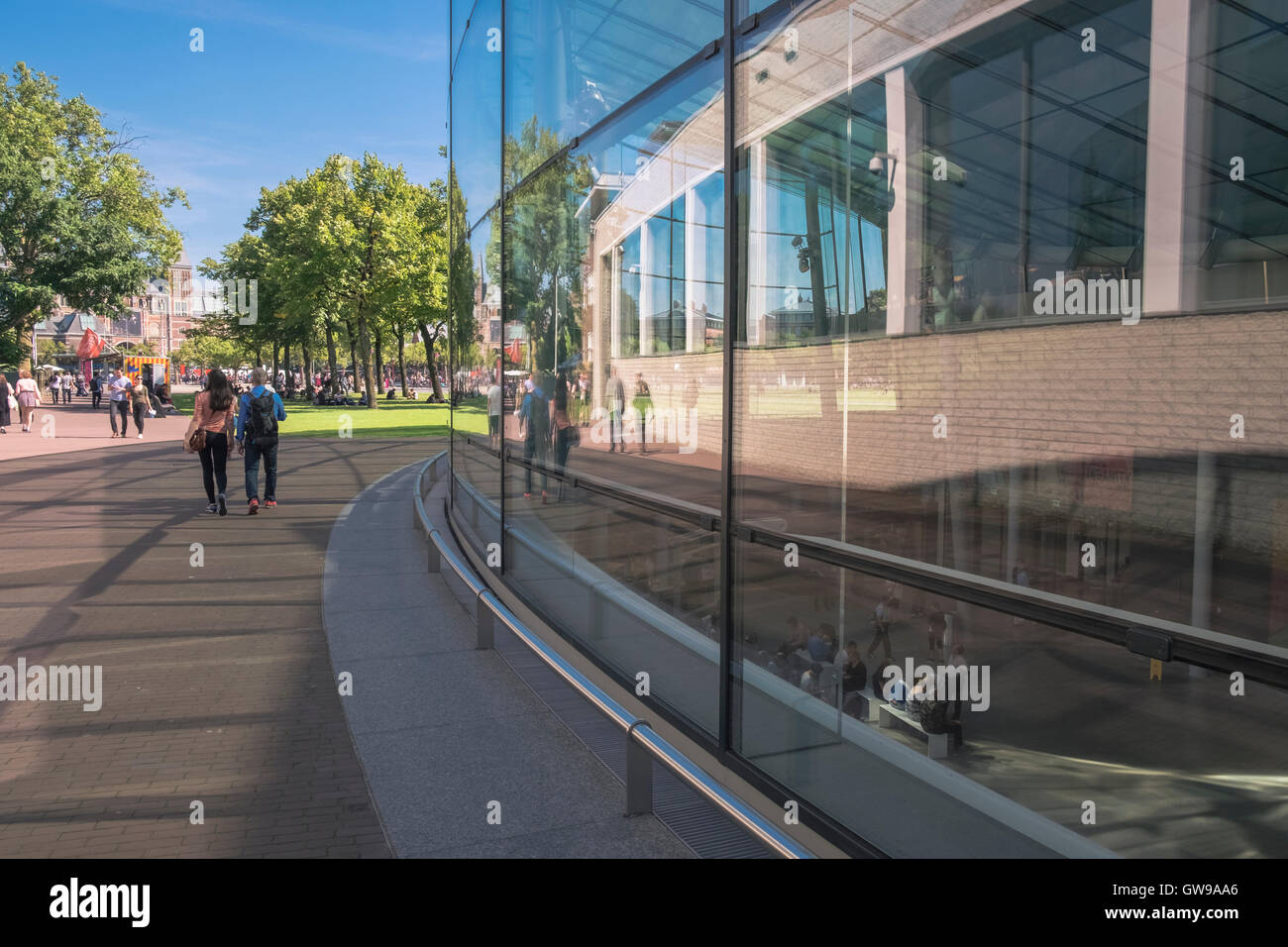 Museum Quarter in Amsterdam, with modern architecture glass exterior of Van Gogh Museum, and Rijks Museum in the background, Amsterdam, Netherlands Stock Photo