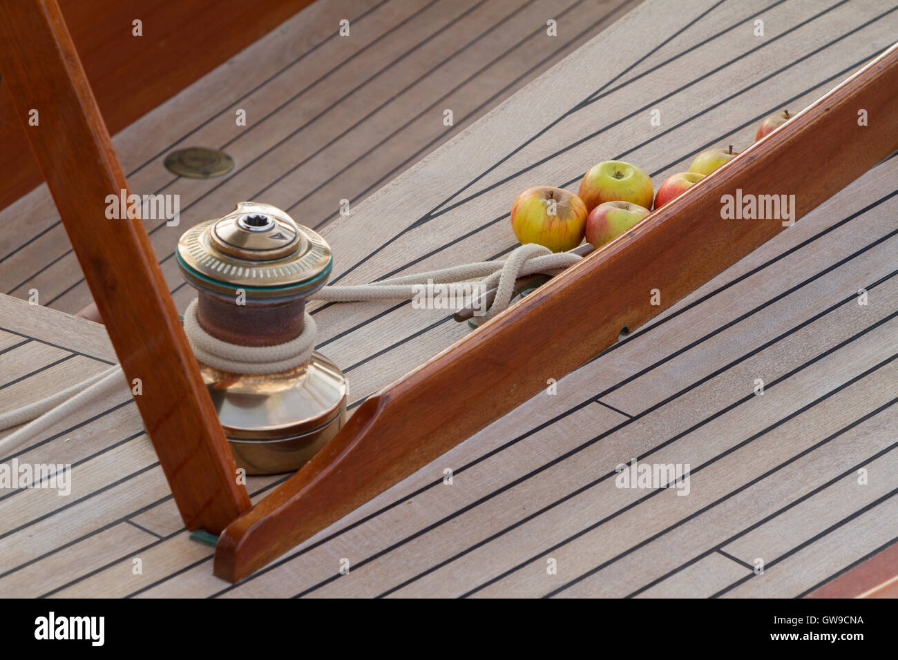 Apples on the deck of a classic sailing yacht Stock Photo