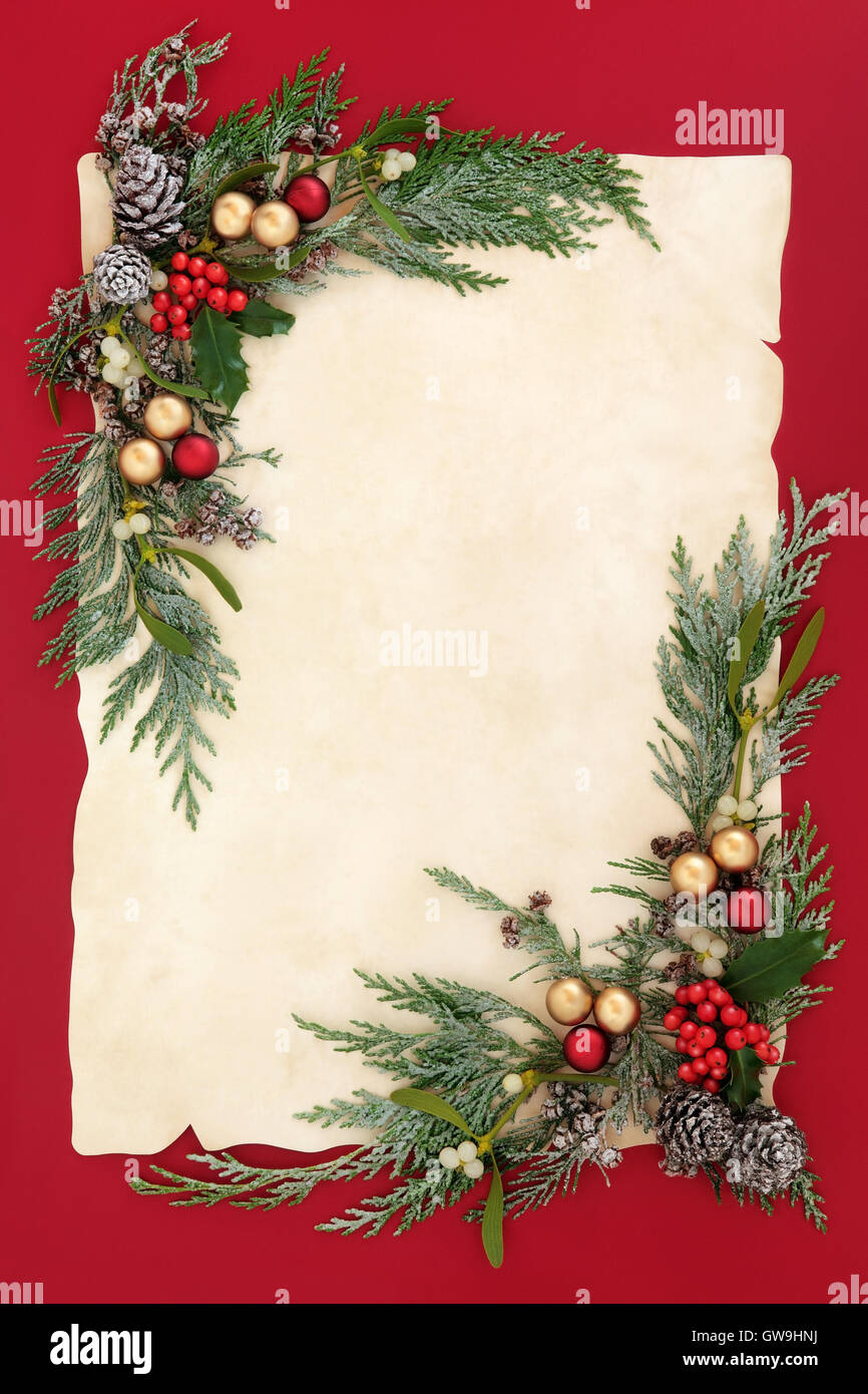 Christmas abstract background border with gold and red bauble decorations,  holly, mistletoe, snow covered cedar cypress and pine Stock Photo - Alamy